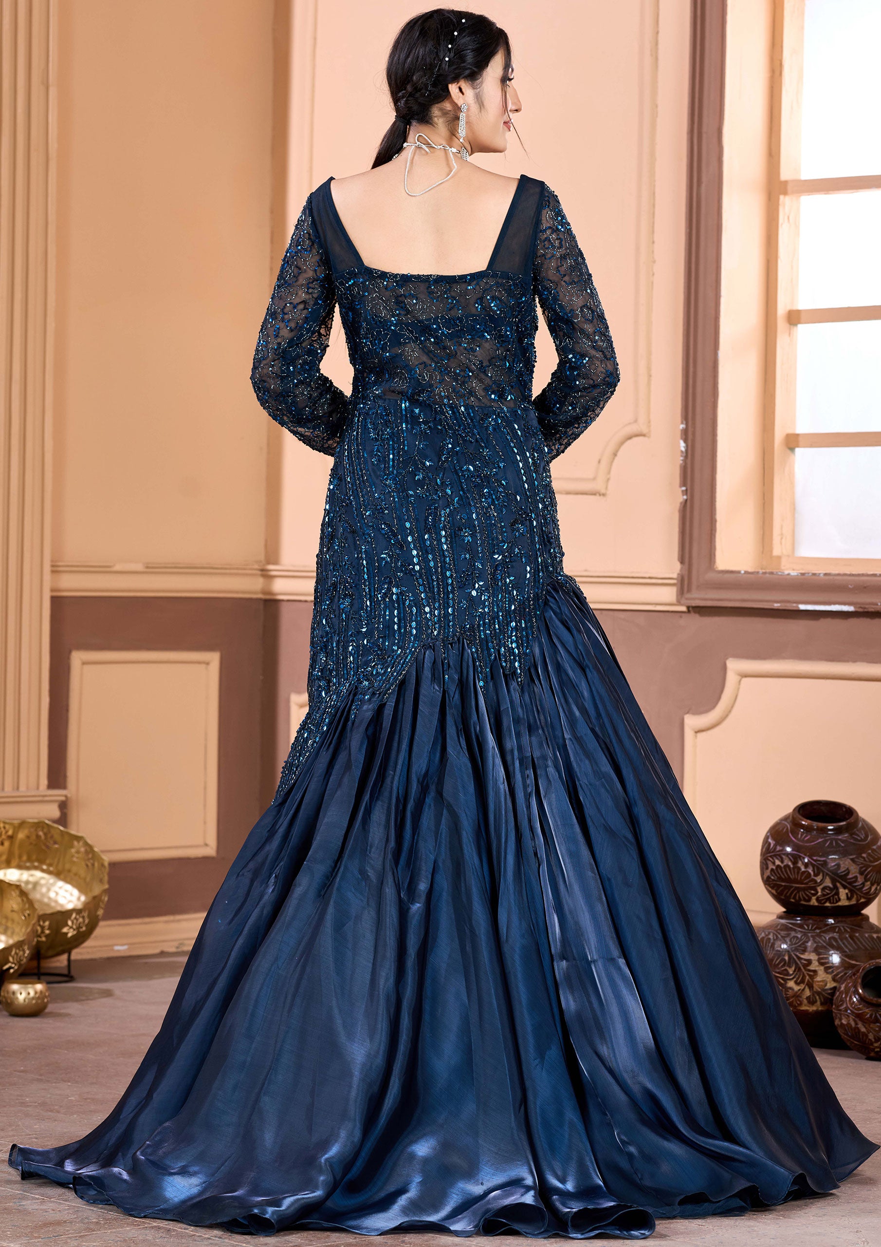 Stunning navy blue satin gown featuring delicate embroidery, ideal for special occasions.