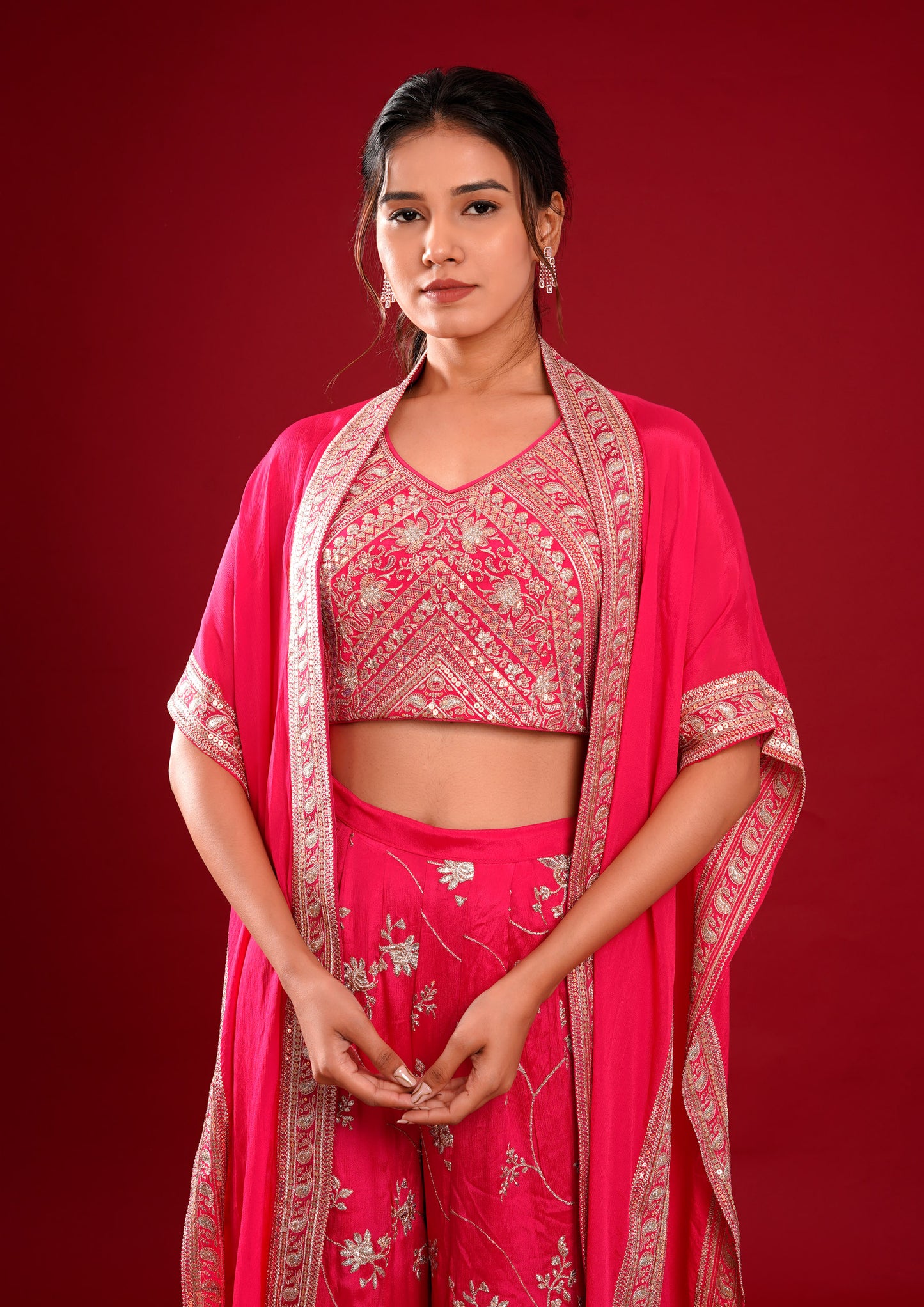 a woman in a pink outfit posing for a picture