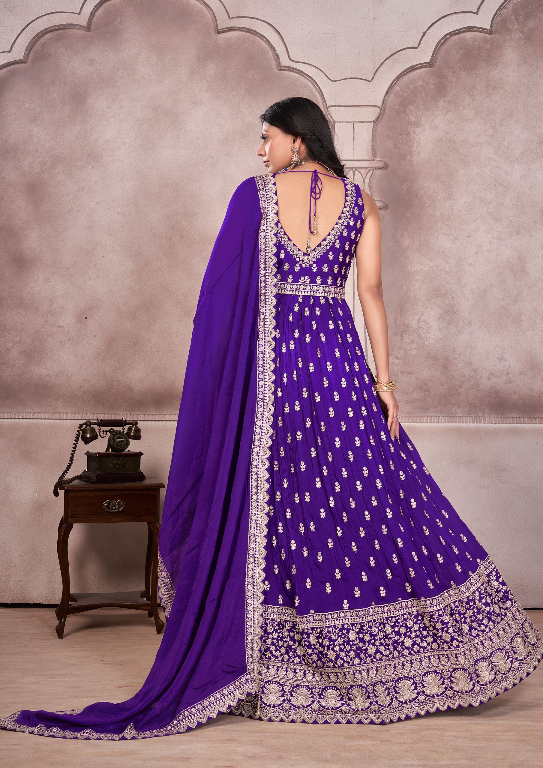 A stunning purple embroidered anarkali suit, perfect for any special occasion.