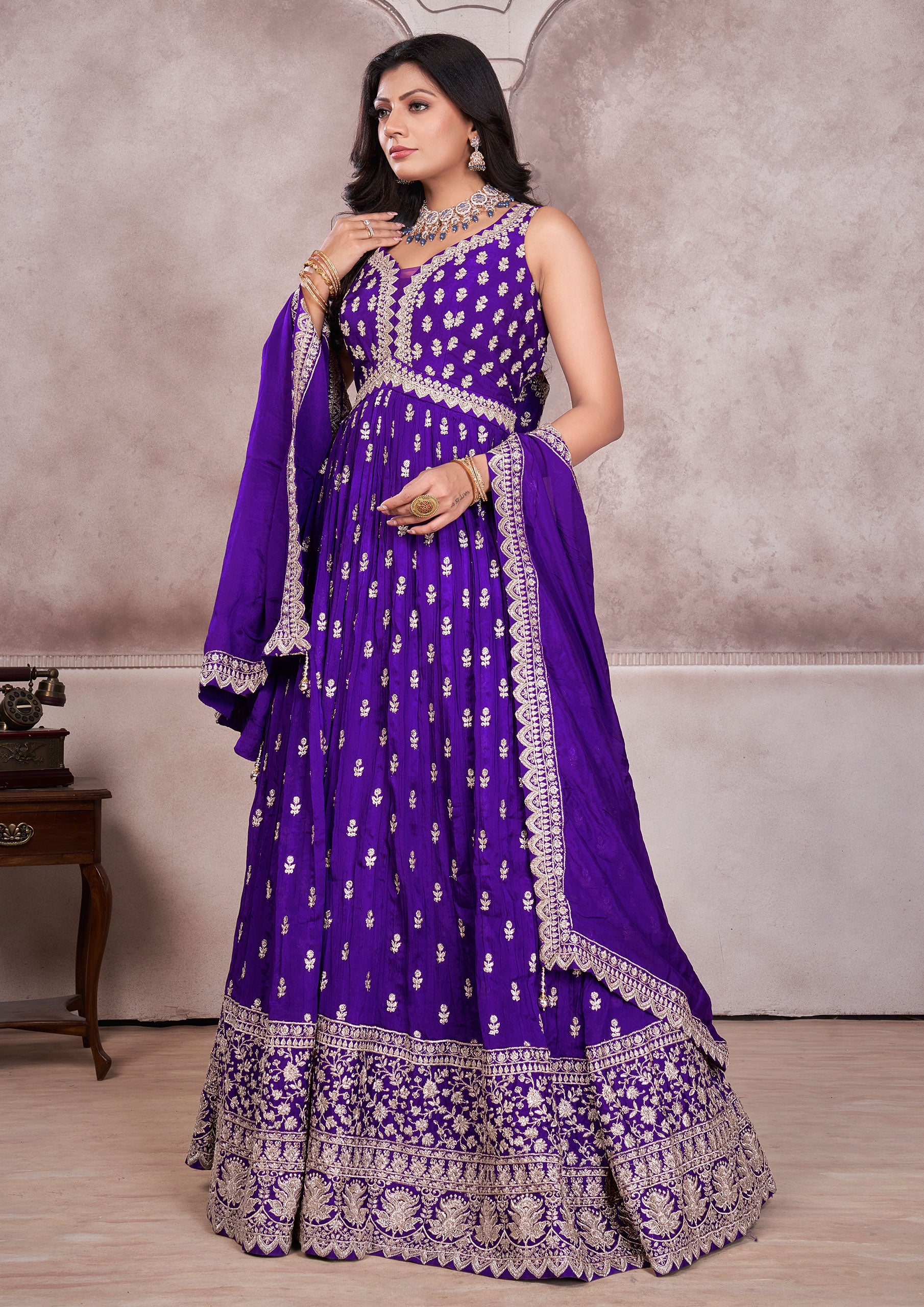 A stunning purple embroidered anarkali suit, perfect for any special occasion.