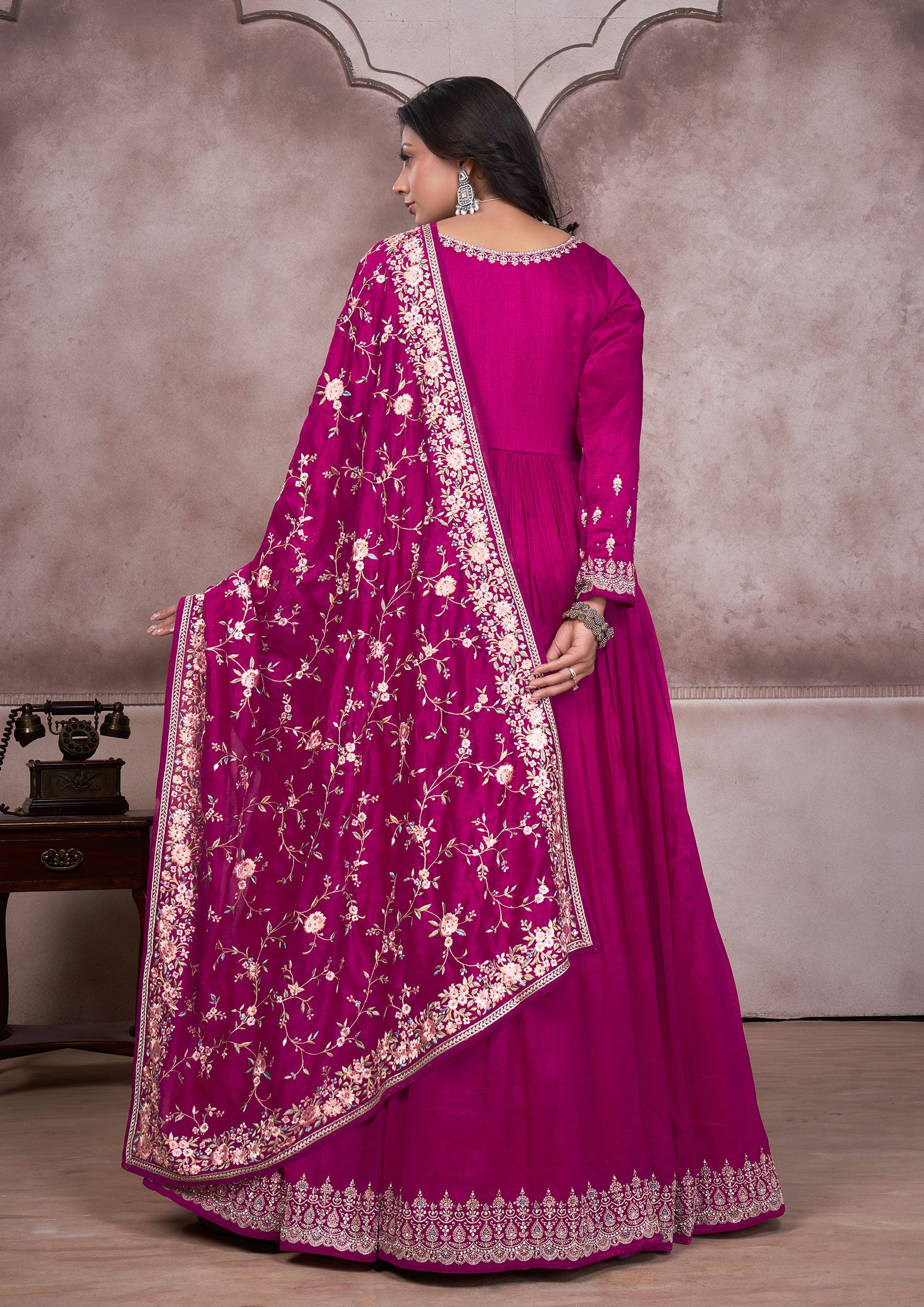 Stunning pink anarkali suit featuring intricate embroidery, a must-have for celebrations.