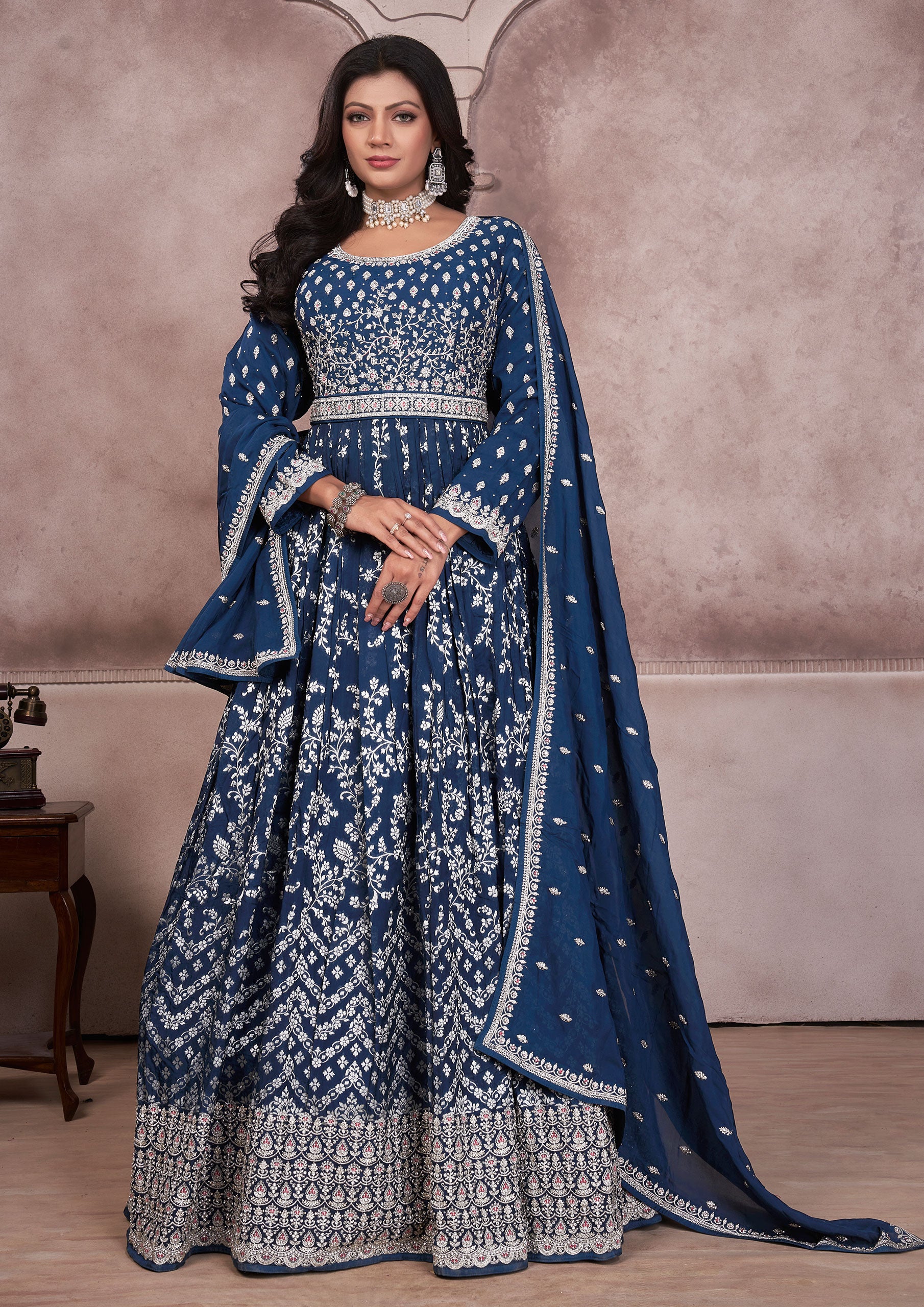 Blue embroidered anarkali suit with intricate patterns and elegant design, perfect for special occasions.